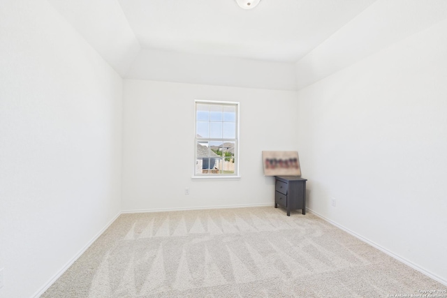 unfurnished room with baseboards and carpet flooring