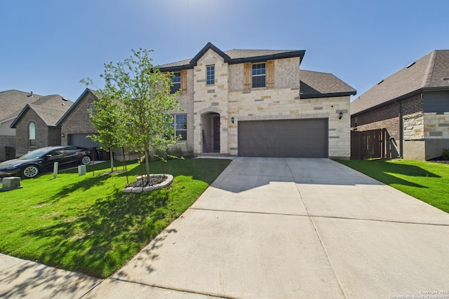 french provincial home with stone siding, a front lawn, fence, and concrete driveway