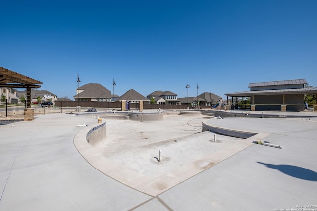 view of home's community featuring fence, a residential view, and a gazebo