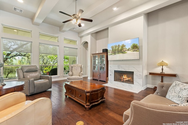 30336 Setterfeld Cir, Fair Oaks Ranch, TX 78015 - living area with arched walkways, a premium fireplace, visible vents, and hardwood / wood-style flooring