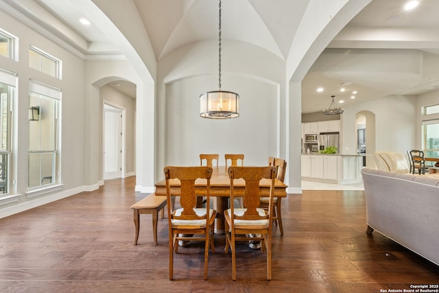 30336 Setterfeld Cir, Fair Oaks Ranch, TX 78015 - dining area featuring arched walkways, a notable chandelier, and dark wood-style flooring