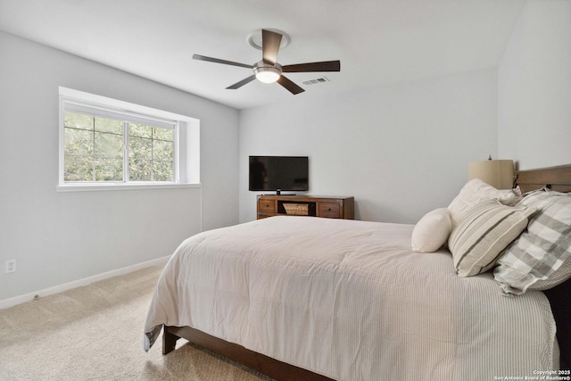 bedroom featuring baseboards, a ceiling fan, visible vents, and carpet