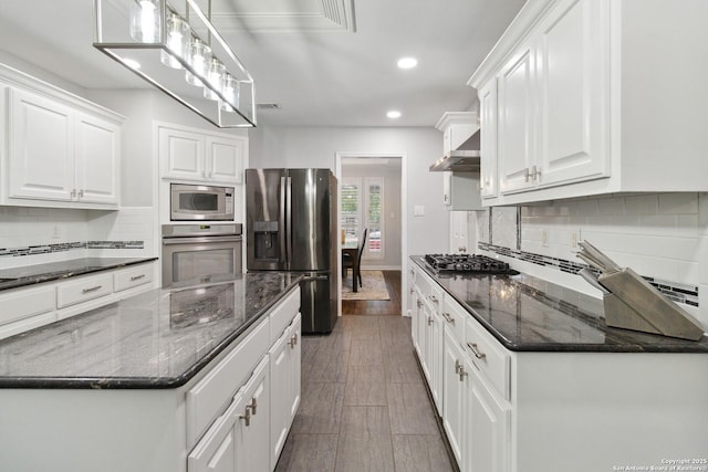 kitchen with recessed lighting, white cabinetry, decorative backsplash, and stainless steel appliances