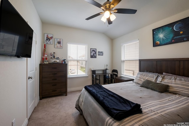bedroom with ceiling fan, baseboards, carpet flooring, and vaulted ceiling