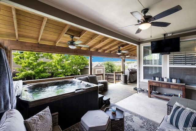 sunroom featuring a hot tub and ceiling fan