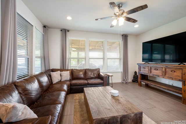 living room with recessed lighting, a wealth of natural light, baseboards, and ceiling fan