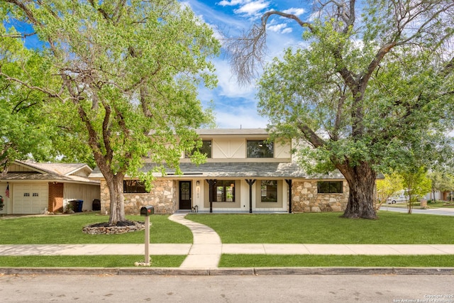 3102 Mindoro, San Antonio, TX 78217 - view of front of property with a garage, a porch, stone siding, and a front lawn