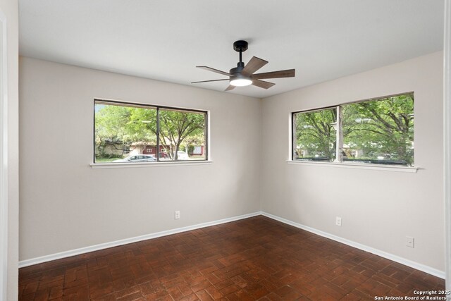 3102 Mindoro, San Antonio, TX 78217 - spare room with plenty of natural light, a ceiling fan, and baseboards