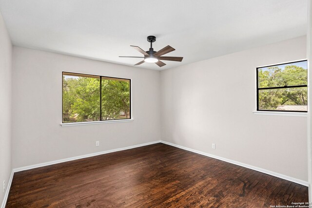 3102 Mindoro, San Antonio, TX 78217 - unfurnished room with baseboards, ceiling fan, and dark wood-style flooring