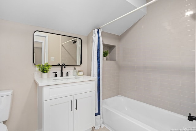 3102 Mindoro, San Antonio, TX 78217 - full bathroom featuring lofted ceiling, shower / bath combination with curtain, vanity, and toilet