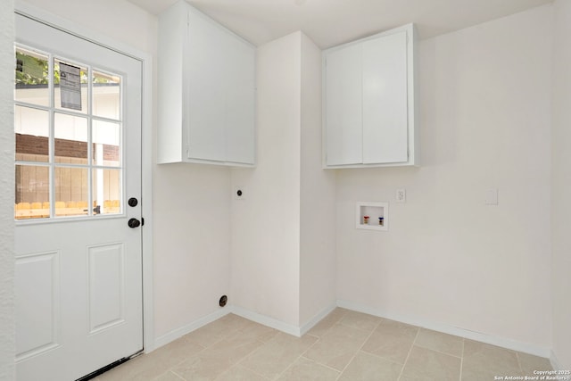 3102 Mindoro, San Antonio, TX 78217 - laundry room featuring electric dryer hookup, cabinet space, hookup for a washing machine, and baseboards
