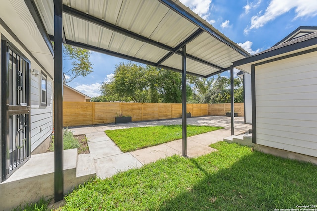 view of yard with a fenced backyard and a patio area