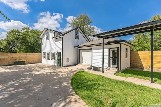 exterior space featuring a patio area, a fenced backyard, driveway, and entry steps