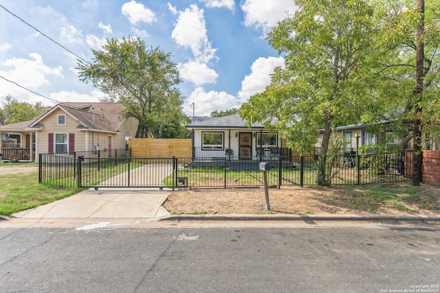 bungalow with a gate, a front yard, and a fenced front yard