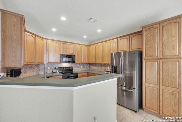 kitchen featuring a peninsula, visible vents, decorative backsplash, black appliances, and light tile patterned floors