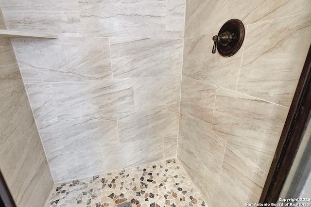details with a tile shower