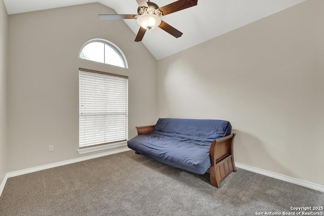 sitting room featuring baseboards, vaulted ceiling, carpet flooring, and a ceiling fan