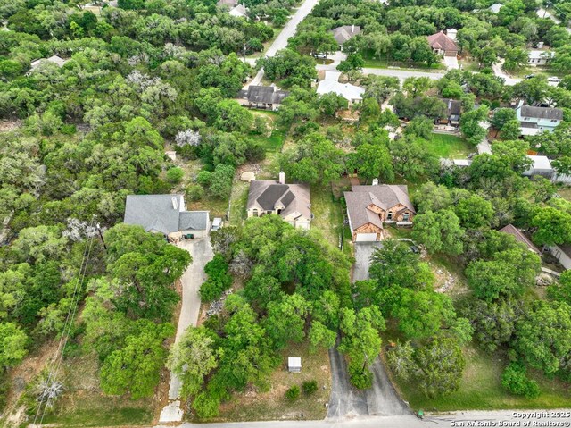 birds eye view of property with a residential view