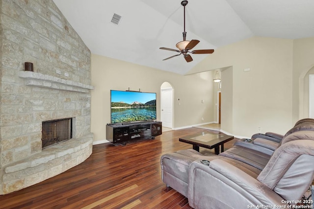living room with vaulted ceiling, arched walkways, ceiling fan, and wood-type flooring