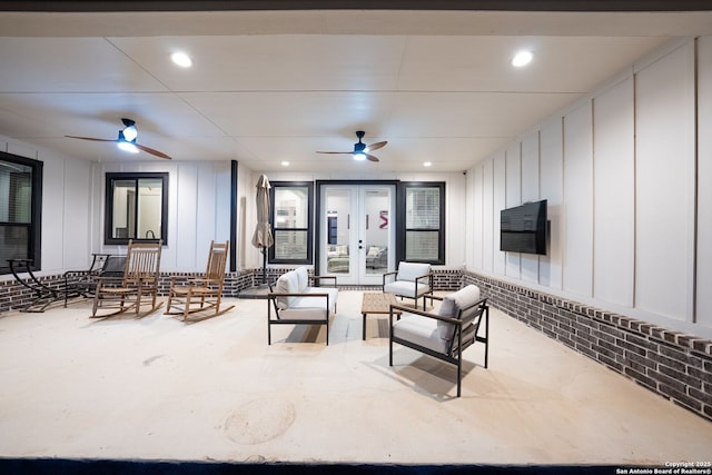 132 Ash Pkwy, La Vernia, TX 78121 - interior space with a decorative wall, a ceiling fan, and french doors
