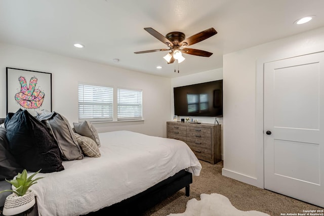bedroom featuring recessed lighting, a ceiling fan, and light colored carpet