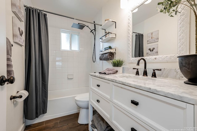 bathroom with toilet, vanity, wood finished floors, and shower / bath combo with shower curtain