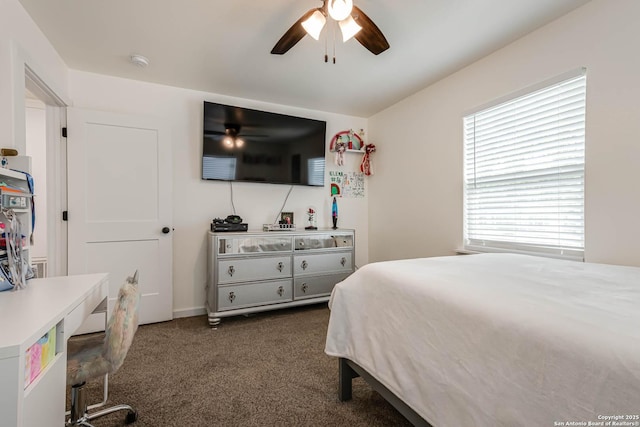 bedroom with dark carpet and a ceiling fan