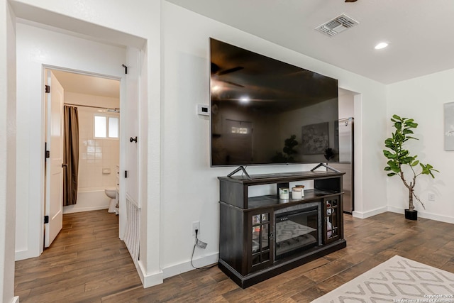 hall with baseboards, visible vents, recessed lighting, and dark wood-style floors