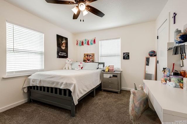 carpeted bedroom with baseboards and ceiling fan