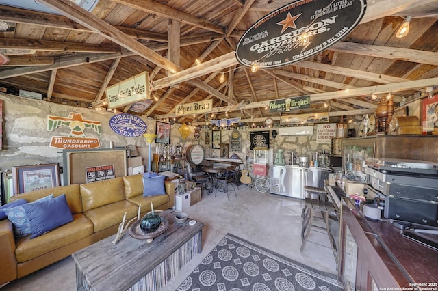 283 N Second St, Harper, TX 78631 - living area featuring wood ceiling, concrete flooring, and vaulted ceiling
