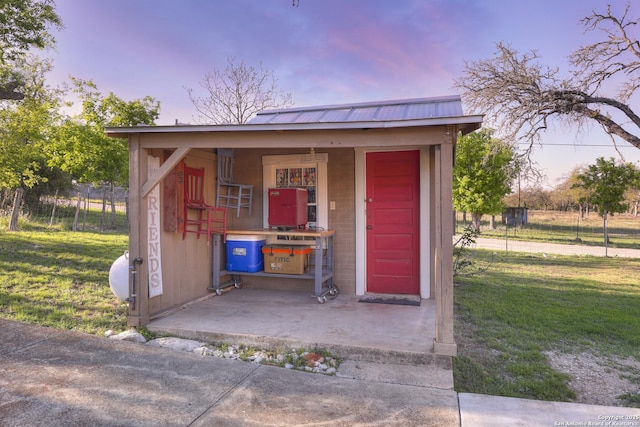 283 N Second St, Harper, TX 78631 - outdoor structure at dusk featuring fence and a yard