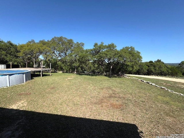 view of yard with an outdoor pool