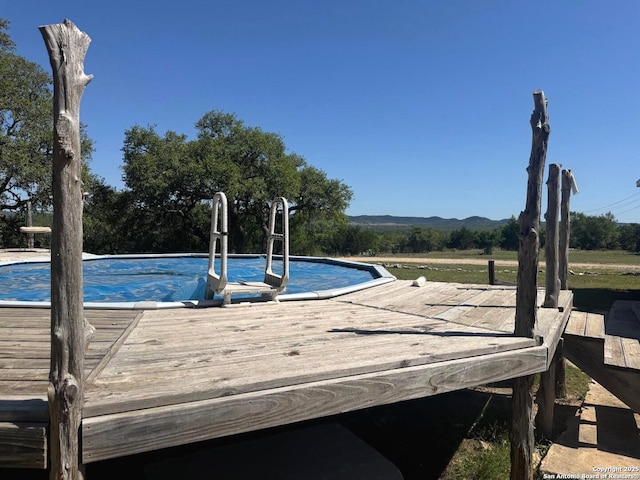 pool featuring a deck with mountain view