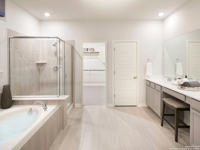 29524 Ringo Way, San Antonio, TX 78260 - bathroom featuring a garden tub, vanity, a shower stall, and a walk in closet