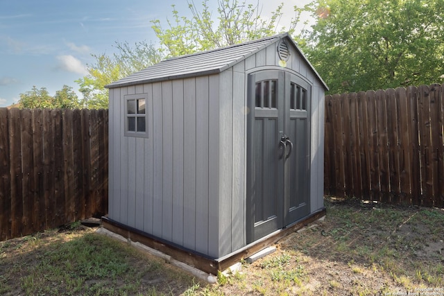 view of shed featuring a fenced backyard