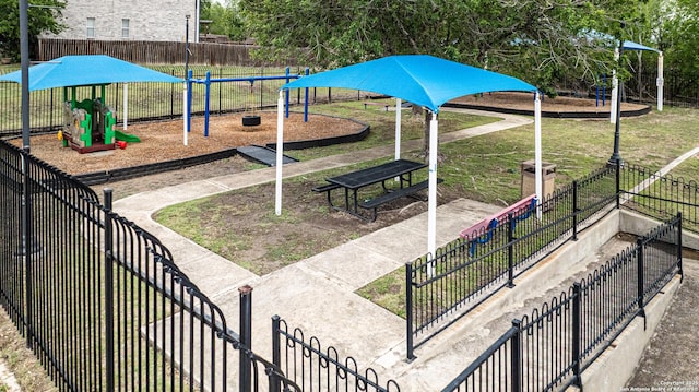 community jungle gym featuring fence