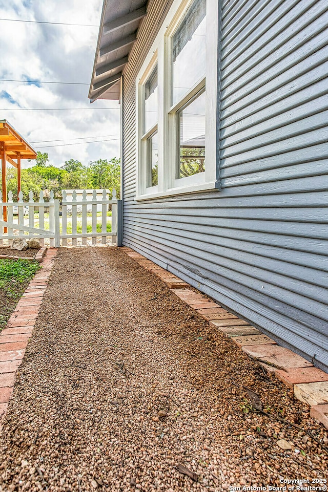 view of property exterior with fence