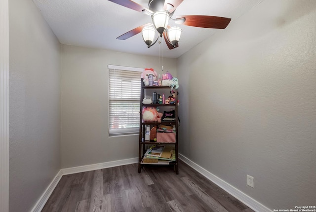 911 Porter St, San Antonio, TX 78210 - interior space featuring baseboards, a ceiling fan, and dark wood-style floors