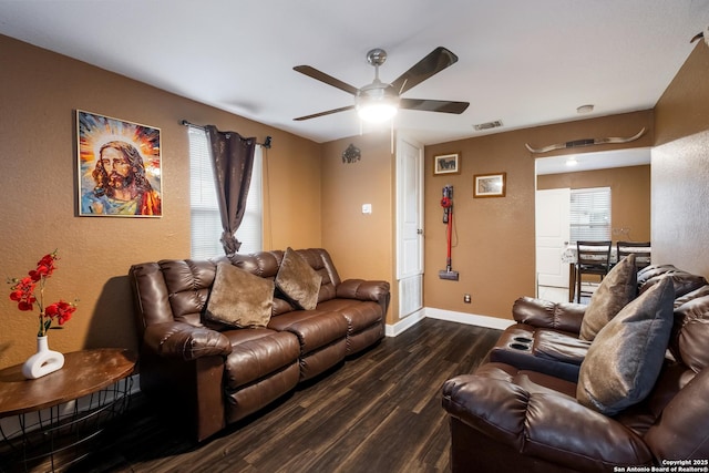 911 Porter St, San Antonio, TX 78210 - living room featuring ceiling fan, baseboards, dark wood-style flooring, and a textured wall