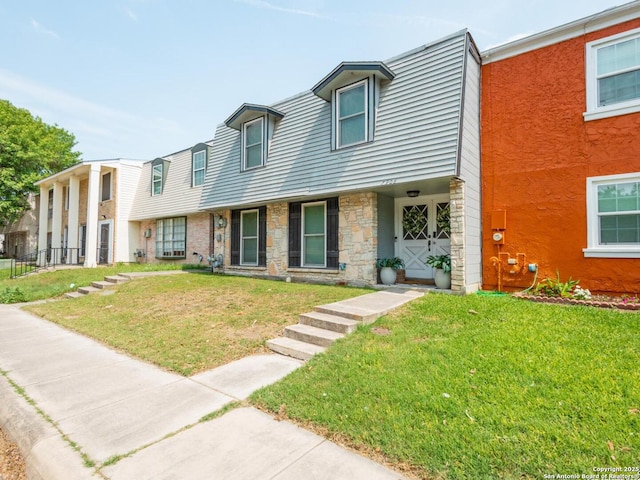 7906 Winsford, San Antonio, TX 78239 - view of property featuring stone siding and a front yard