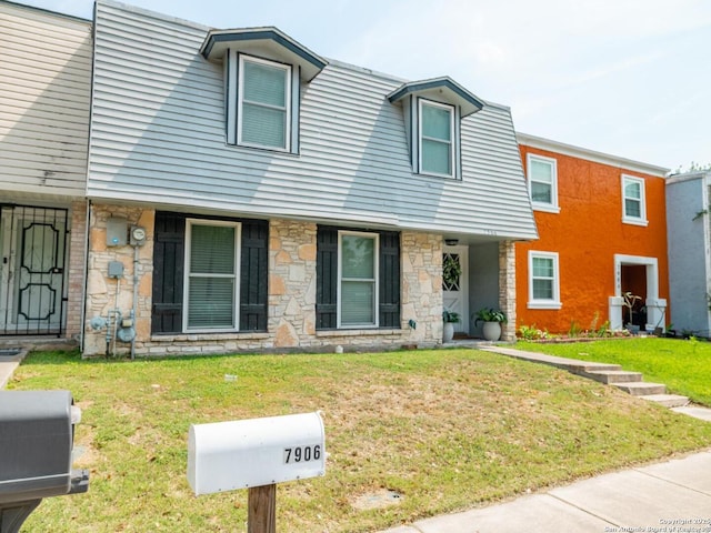 7906 Winsford, San Antonio, TX 78239 - townhome / multi-family property with stone siding and a front lawn