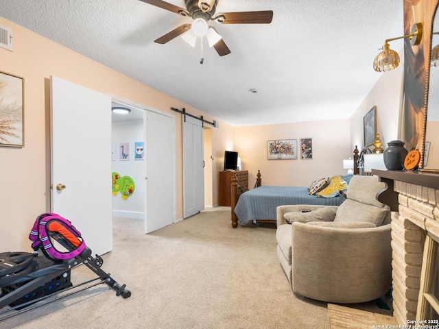 7906 Winsford, San Antonio, TX 78239 - bedroom with a barn door, carpet, a textured ceiling, and a ceiling fan