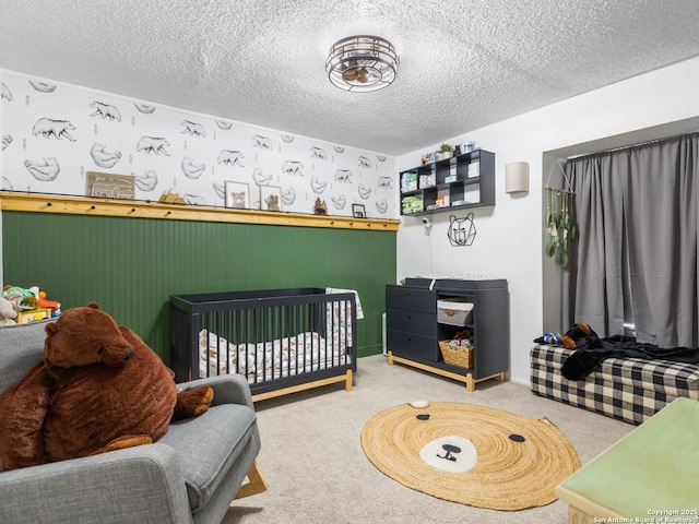 7906 Winsford, San Antonio, TX 78239 - carpeted bedroom with a textured ceiling and a crib