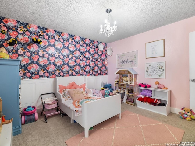 7906 Winsford, San Antonio, TX 78239 - carpeted bedroom featuring a chandelier, a wainscoted wall, a textured ceiling, and wallpapered walls