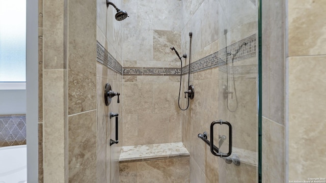 full bath with a shower stall