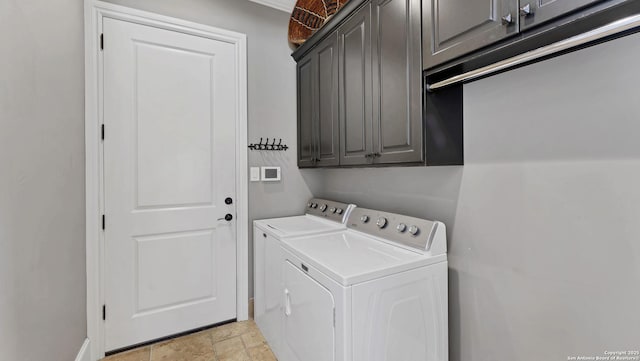 washroom featuring cabinet space, independent washer and dryer, and stone finish flooring