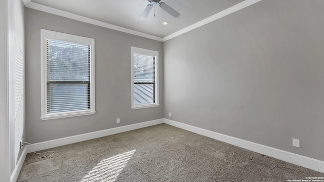 spare room featuring ceiling fan, baseboards, ornamental molding, and carpet floors