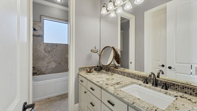 bathroom featuring tile patterned flooring, vanity, and ornamental molding