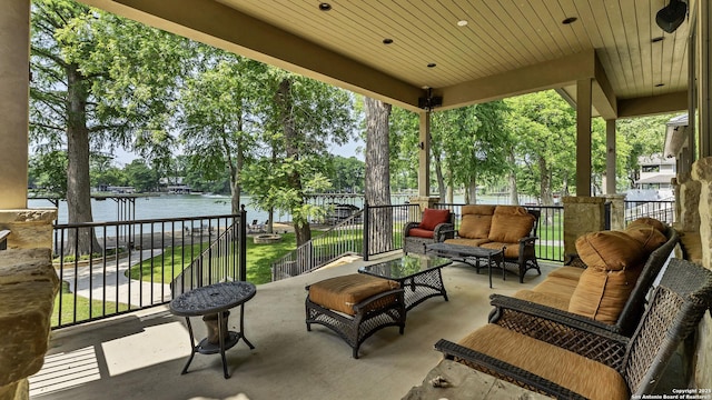 view of patio / terrace with outdoor lounge area and a water view