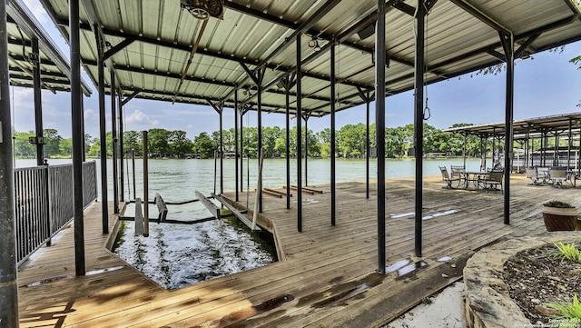view of dock featuring a water view and boat lift